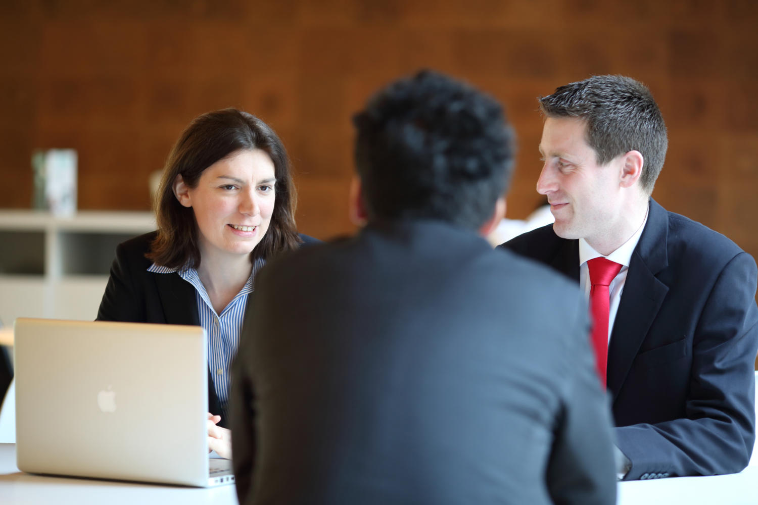 Oxera staff in a meeting